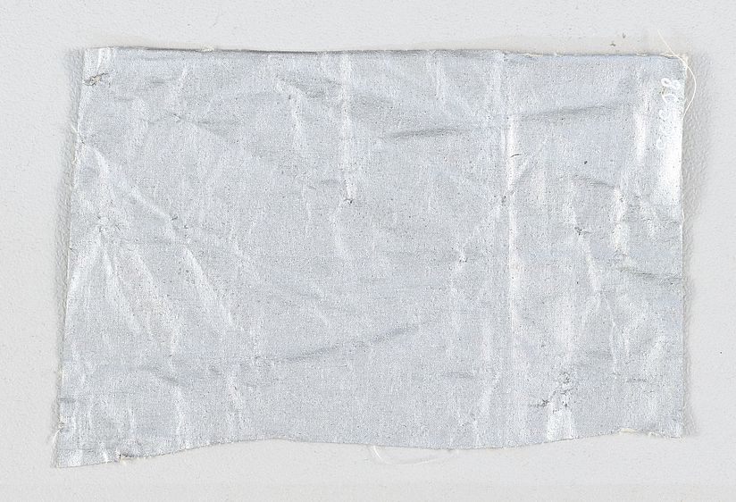 Stück vom Bespannstoff des Luftschiffes LZ 127 "Graf Zeppelin".